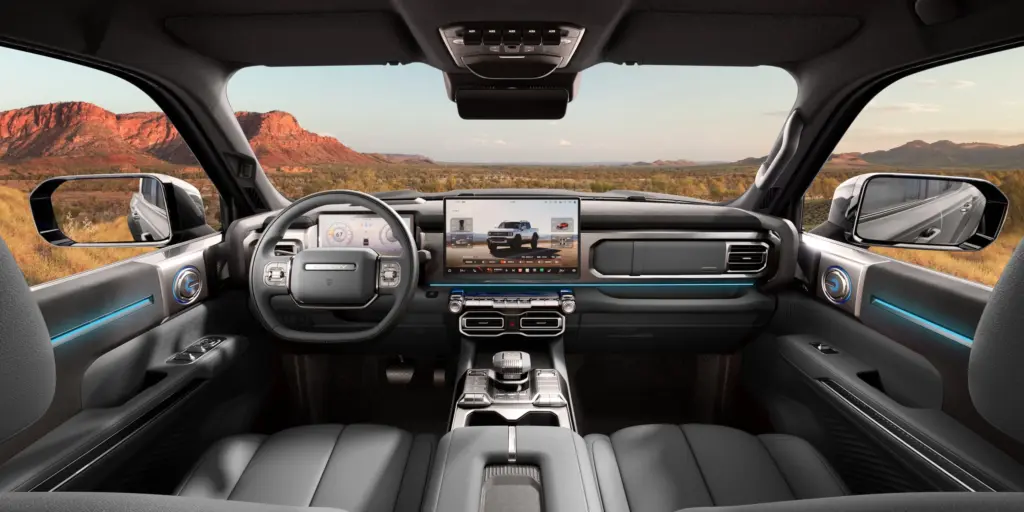 Interior da Chery Stockman com painel digital, tela central, console e iluminação azul em render oficial